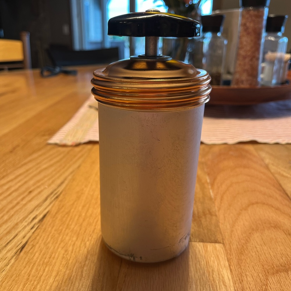 Cookie Press - aluminum and copper-tone with 3 discs that each have 4 designs